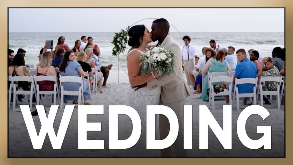 The couple shares kiss after Panama City Beach wedding ceremony.